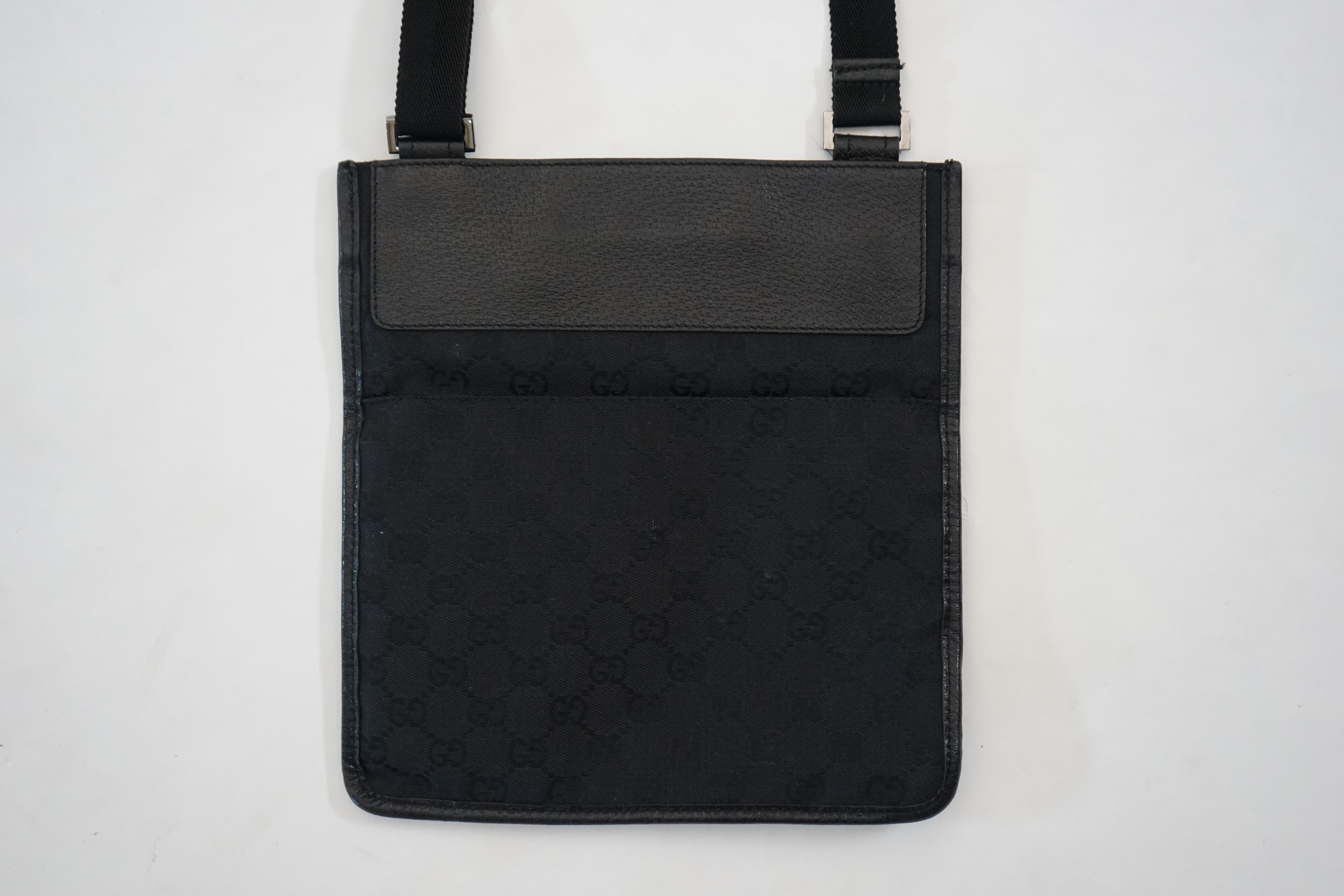 A Gucci black GG canvas crossbody bag Approx width 25cm, depth 1cm, length 24cm, shoulder drop 47cm